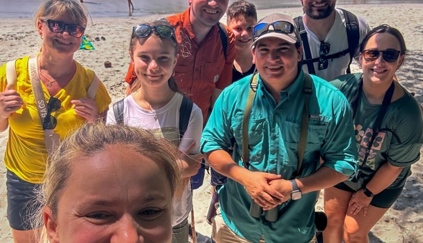 Wakoo Tours certified guide with a group at the beach in Manuel Antonio National Park