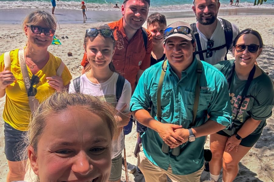 Wakoo Tours certified guide with a group at the beach in Manuel Antonio National Park