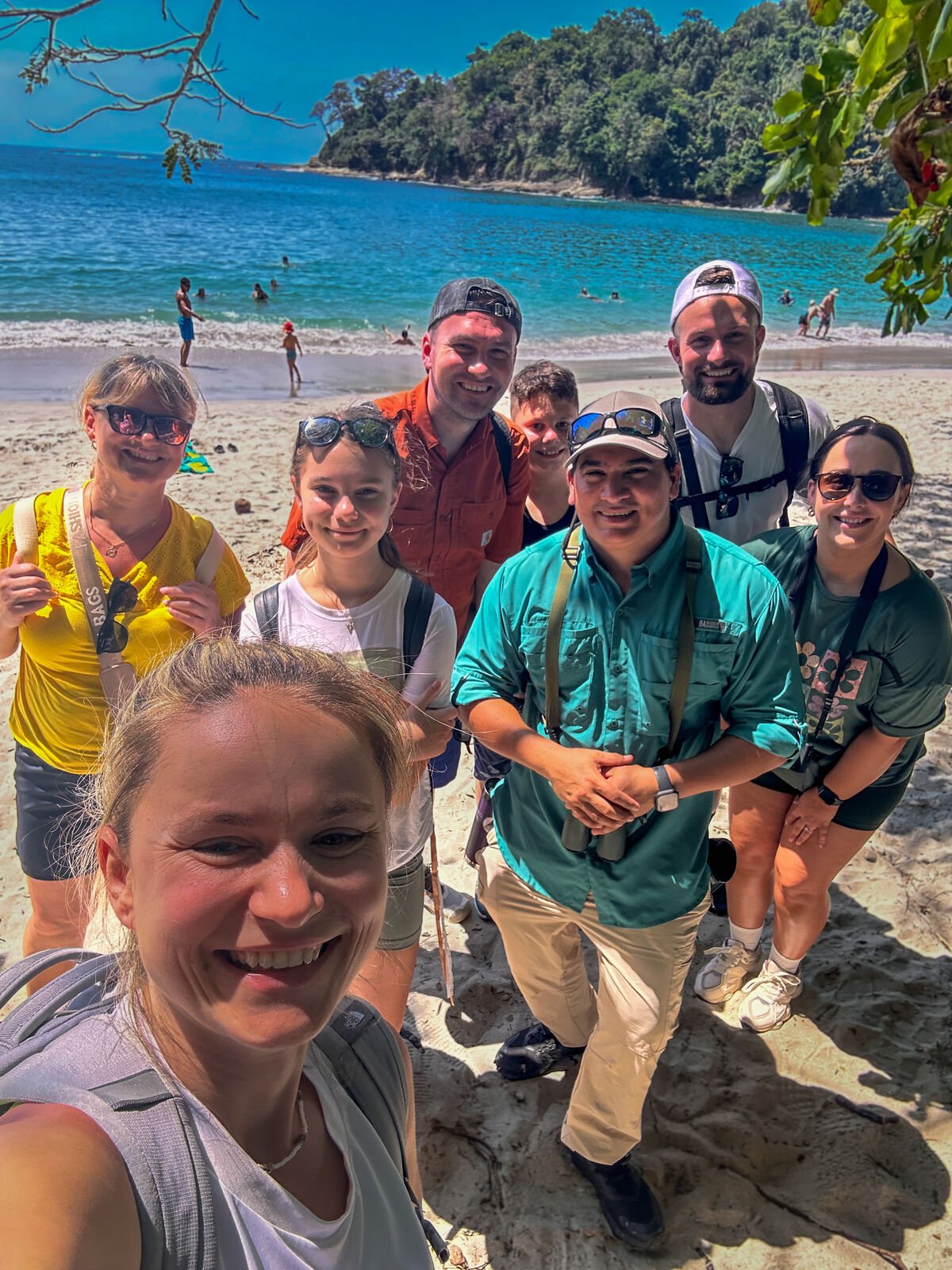 Wakoo Tours certified guide with a group at the beach in Manuel Antonio National Park